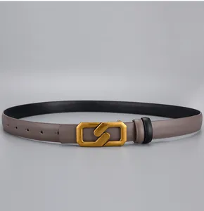 Detailed close-up of taupe leather belt with matte gold geometric buckle for women