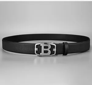 Detail of black lychee grain leather belt featuring a silver automatic buckle with B logo