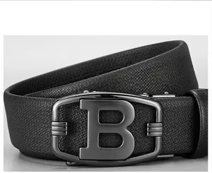 Close-up of black leather belt with alloy automatic buckle and B-shaped detail