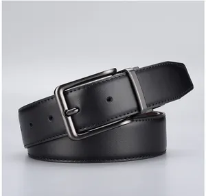Close-up of black leather belt with lychee texture and dark gunmetal pin buckle