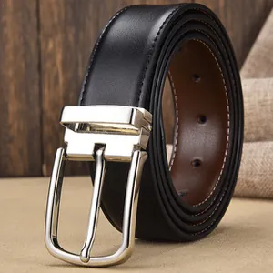 Close-up of black leather belt with silver pin buckle and detailed stitching