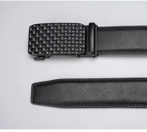 Detail of men's leather belt featuring cross-grain texture and matte woven buckle