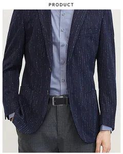 Detail of blue textured suit jacket paired with a black woven stretch belt for men