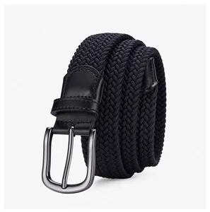 Macro shot of black elastic braided belt showing dense weave and silver pin buckle