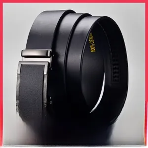 Close-up of black leather belt with textured metal automatic buckle and 100% genuine stamp