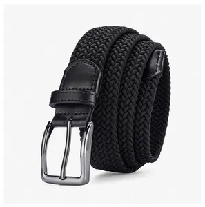 Close-up of black braided elastic belt with gunmetal buckle and leather details