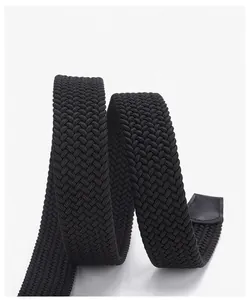 Close-up of black elastic woven belt with reinforced leather end on grey background