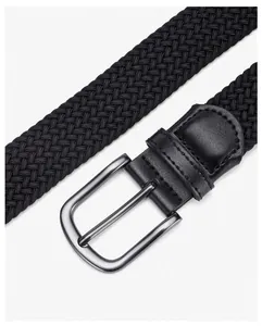 Close-up of black braided elastic belt with silver metal buckle and leather reinforcement