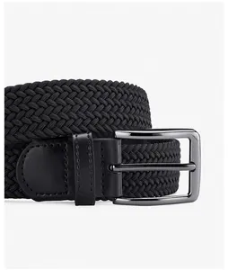 Detail of black woven elastic belt showing high-density fiber texture and metal buckle