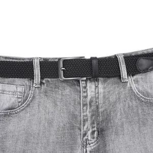 Elastic black woven belt for men with gun-metal pin buckle on denim jeans