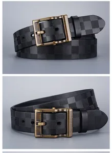 Detail of vintage embossed checkerboard pattern and bronze pin buckle on black leather belt
