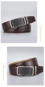 Detail of luxury men's leather belt with brushed alloy buckle and gradient brown strap