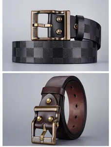 Detail of vintage embossed checkerboard leather belts in black and brown with pin buckles