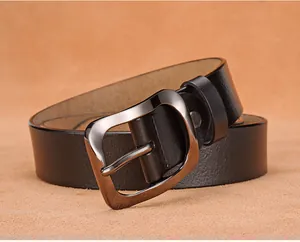 Close-up of premium black leather belt with gunmetal grey buckle and natural grain