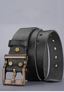 Close-up of vintage bronze pin buckle with rivets on a premium black leather belt