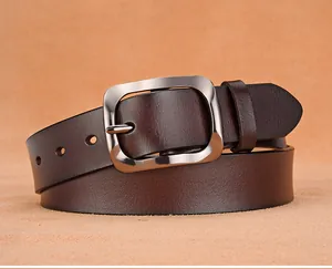 Close-up of deep brown leather belt with vintage silver-gray pin buckle detail