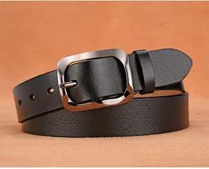 Detailed close-up of premium black leather belt texture and polished silver buckle