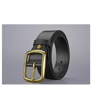 Close-up of black cowhide leather belt with retro brass pin buckle and stitched edges