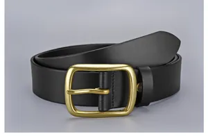 Close-up of premium black leather belt with a brushed gold metal pin buckle detail