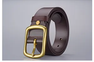 Detail of dark brown leather belt featuring a matte gold pin buckle with thick texture