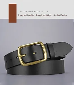 Detail of solid copper buckle with brushed finish on a black leather belt