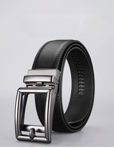 Detail view of premium black leather belt showing ratchet track and brushed metal buckle