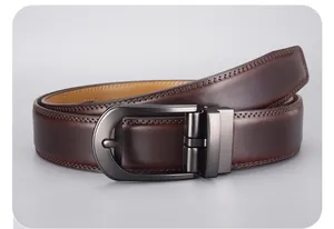 Detailed close-up of dark brown leather belt with double stitching and matte gunmetal buckle