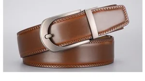 Close-up of brown leather business belt with gunmetal buckle and refined stitching
