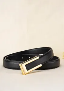 Detail view of premium black leather belt with minimalist gold alloy buckle and stitching