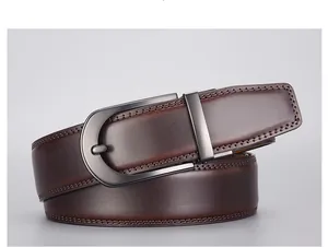 Detail of dark brown leather belt with gray metal buckle and double stitching detail