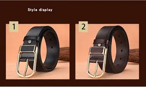 Close-up of black and dark brown leather belts with gold-toned D-ring buckles