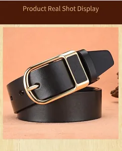 Detail of premium black leather belt with gold needle buckle on a minimalist background