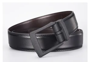Detailed view of dual-sided black and brown leather belt with matte black buckle