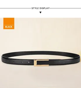 Detailed macro of black leather belt featuring a sleek polished gold metal buckle