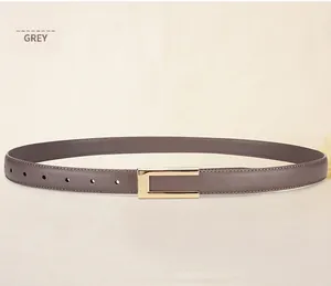 Detail view of elephant grey leather belt with gold metal buckle and stitching