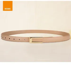 Detail of khaki leather belt with golden metal buckle and fine stitching craftsmanship