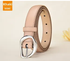 Close-up of khaki leather thin belt featuring a unique irregular silver metal buckle