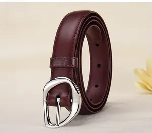 Detail of Angora Red leather belt featuring a unique irregular silver metal buckle