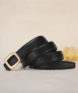 Close-up of elegant black leather belt for women featuring a gold alloy buckle