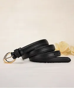 Detail of premium black leather belt with golden alloy pin buckle and stitching
