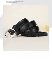 Detail of a black leather belt with a polished silver horseshoe-shaped metal buckle