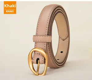 Detail of khaki leather belt with elegant gold oval buckle and fine stitching
