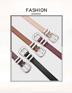 Detail of four colorful leather belts with silver metal pin buckles on a neutral background