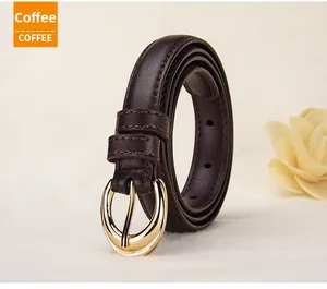 Detailed close-up of dark coffee leather belt with elegant golden oval pin buckle