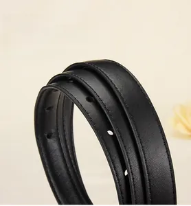 Detail of top grain leather belt with visible texture, stitching, and rounded oil edges