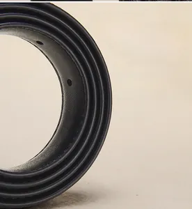 Detailed close-up of premium black leather belt edges with smooth oil-edge finishing