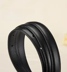 Close-up of black leather belt with fine edge stitching and precise circular punches