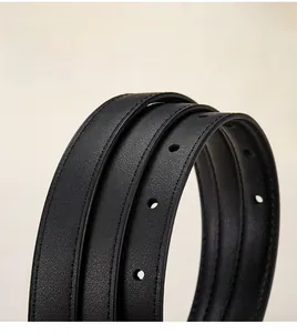 Macro view of genuine leather belt strap showing refined edge stitching and precise holes