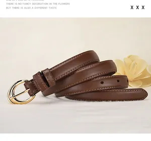 Detail of slim dark brown leather belt with elegant oval golden buckle and fine stitching