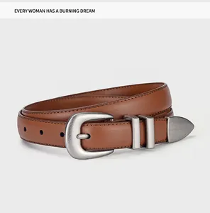 Detail of a brown leather belt with a vintage silver oval buckle and metal end tip
